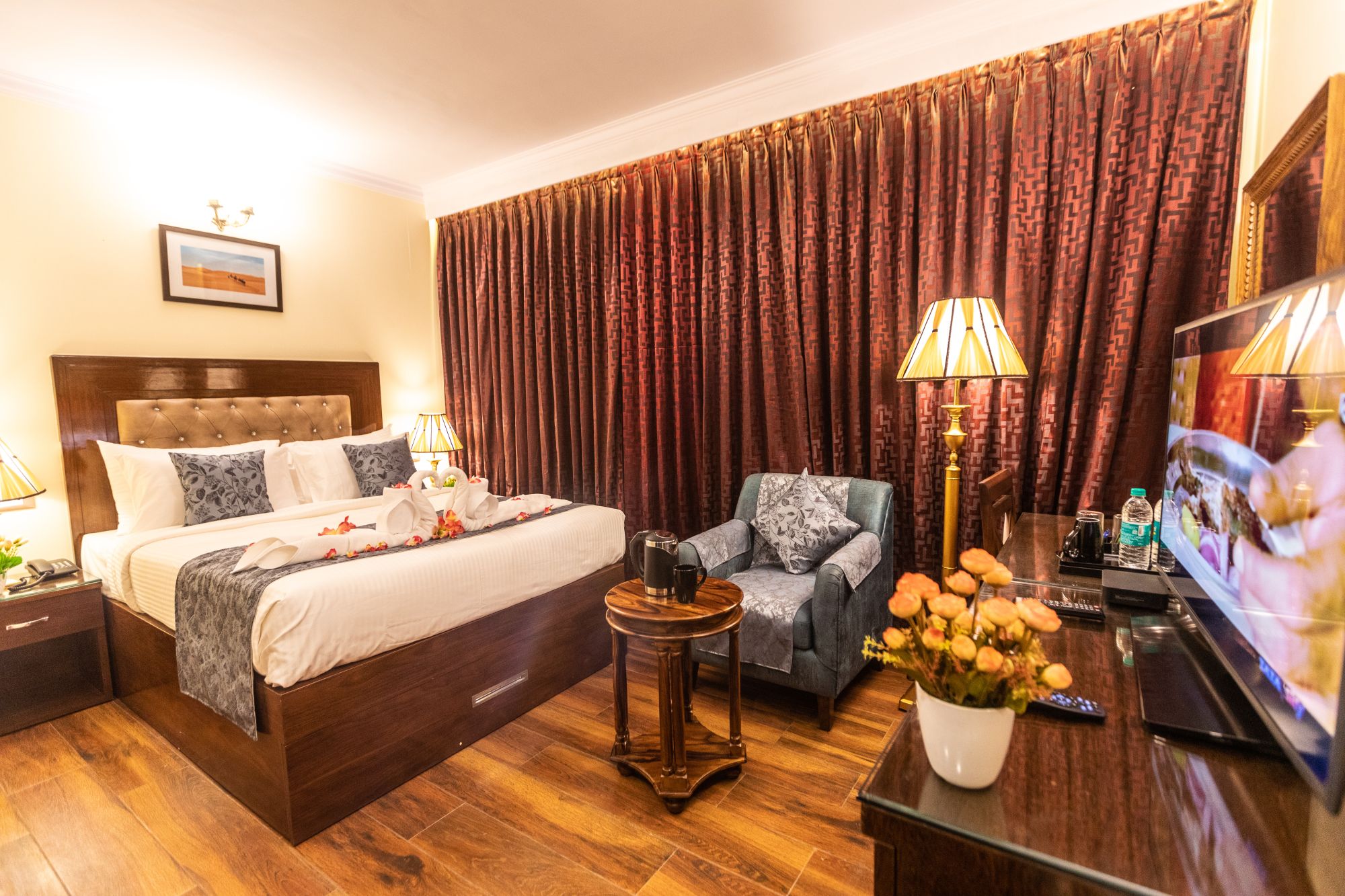 Deluxe Room at Hotel Paramos Inn, Jayanagar, with armchair and desk
