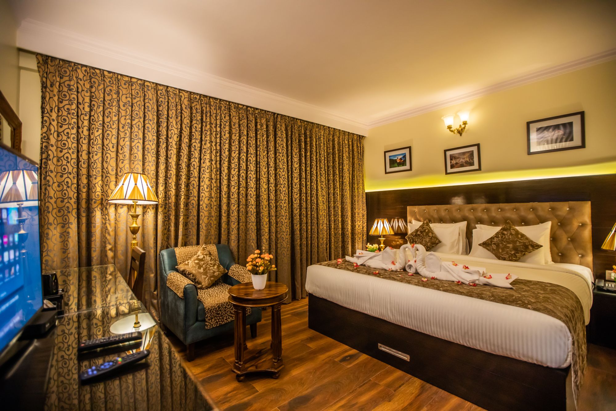 Super Deluxe Room at Hotel Paramos Inn, Jayanagar, with armchair by the window